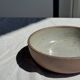 A speckled grey interior bowl with a matte brown exterior H5 D15