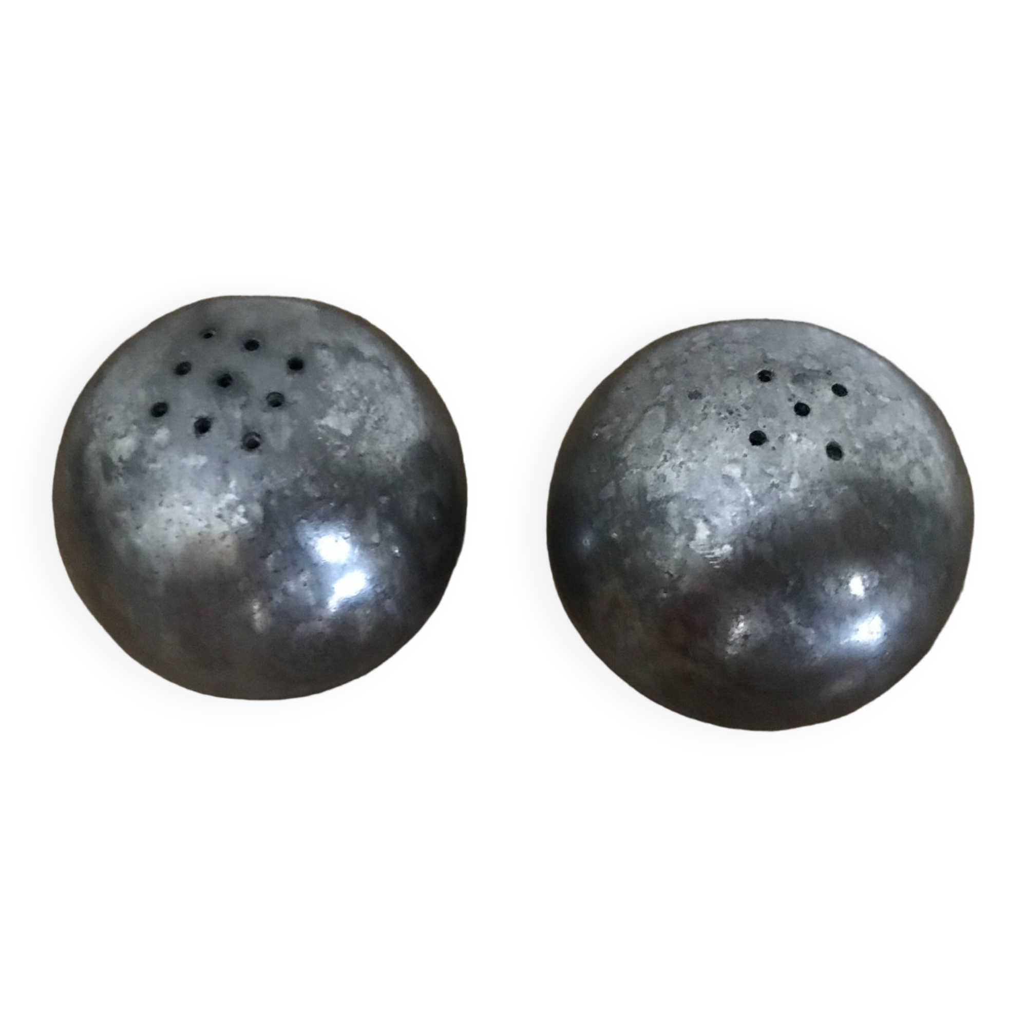 Brutalist salt and pepper ball in cast steel