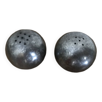 Brutalist salt and pepper ball in cast steel