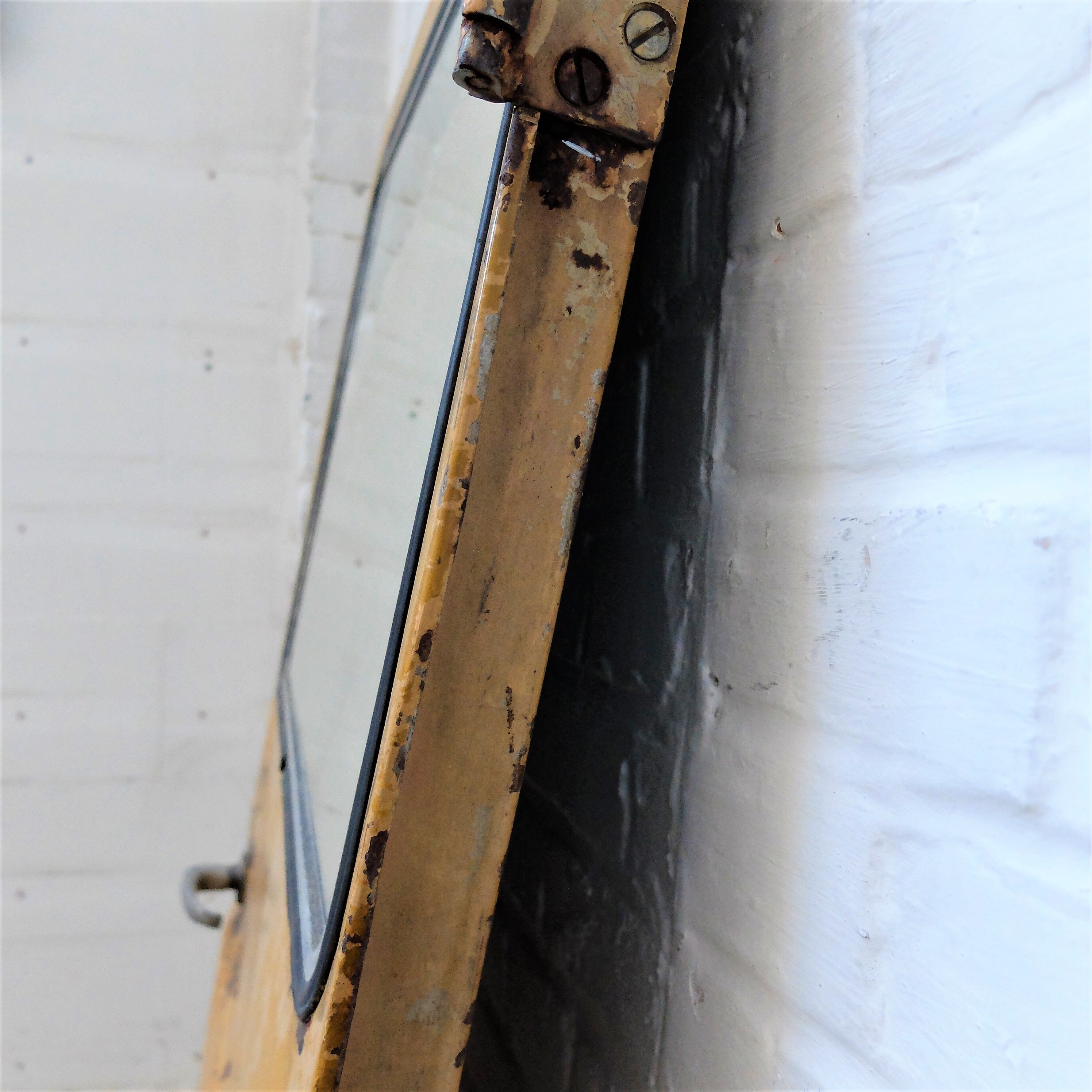 Yellow industrial mirror