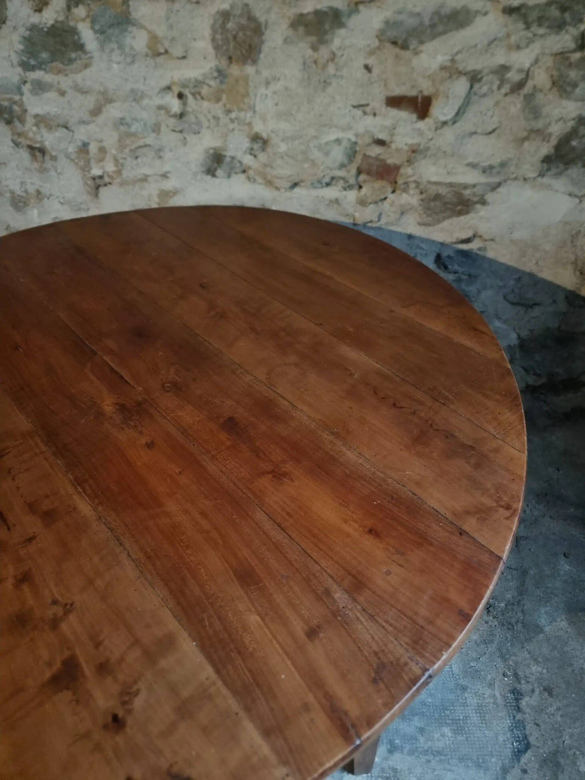Antique round dining table in cherry wood, France, circa 1920.