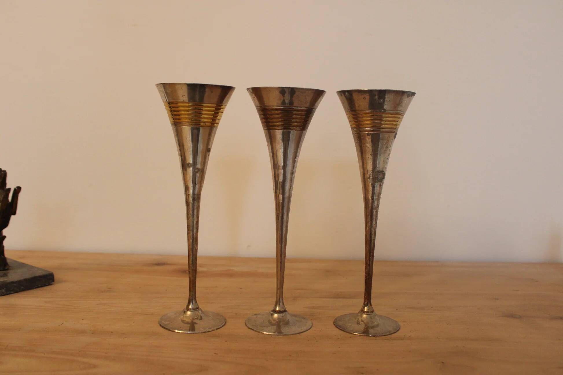 Set of 3 vintage silver-plated and gold footed cups.