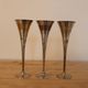 Set of 3 vintage silver-plated and gold footed cups.