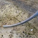 Table with chrome metal legs and smoked glass top.