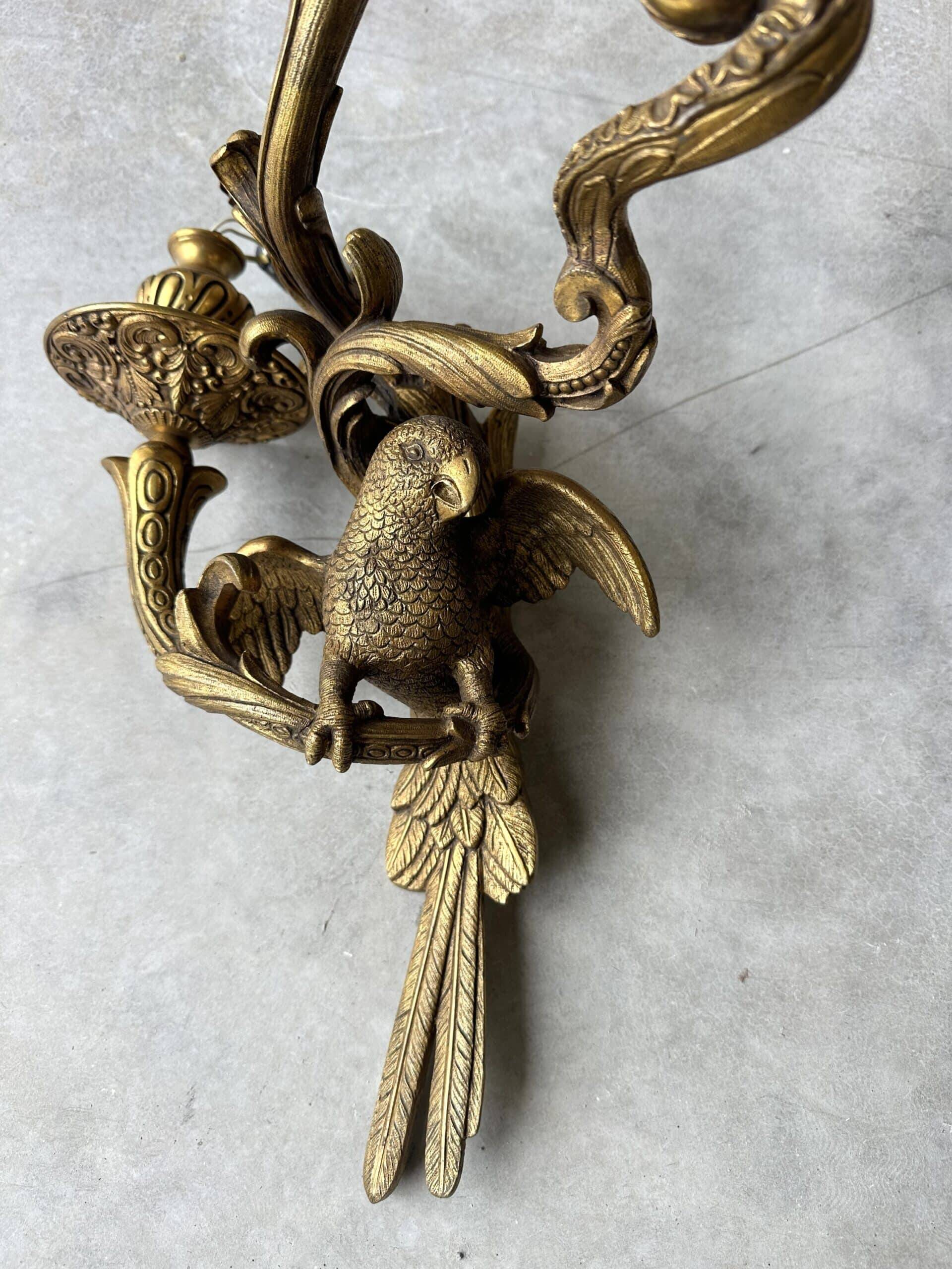 Pair of bronze wall sconces with parrots, early 20th century.