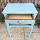 Pair of patinated lagoon blue bedside tables, early 20th century, with curved legs.
