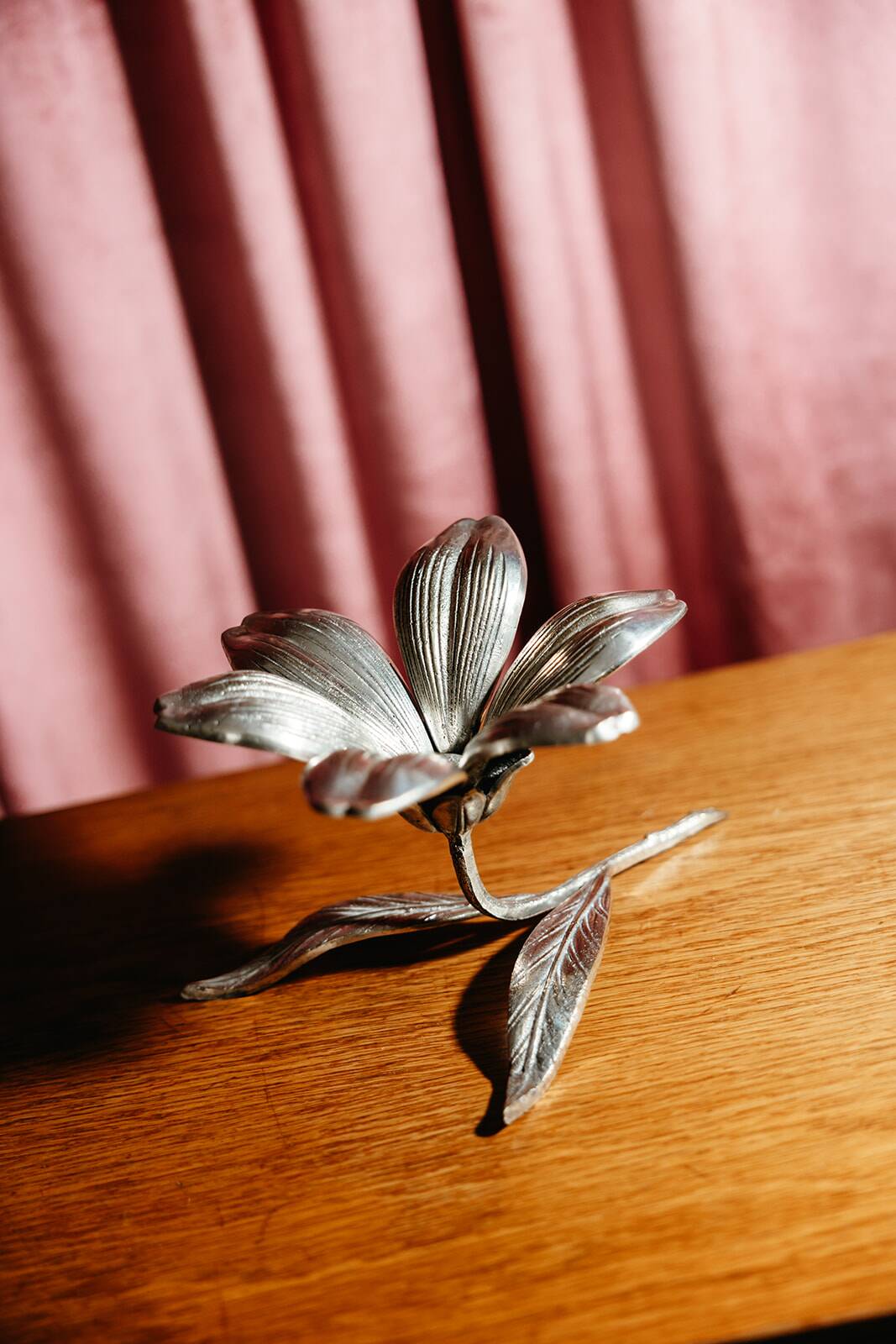 Vintage brass flower ashtray with removable petals.