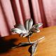 Vintage brass flower ashtray with removable petals.