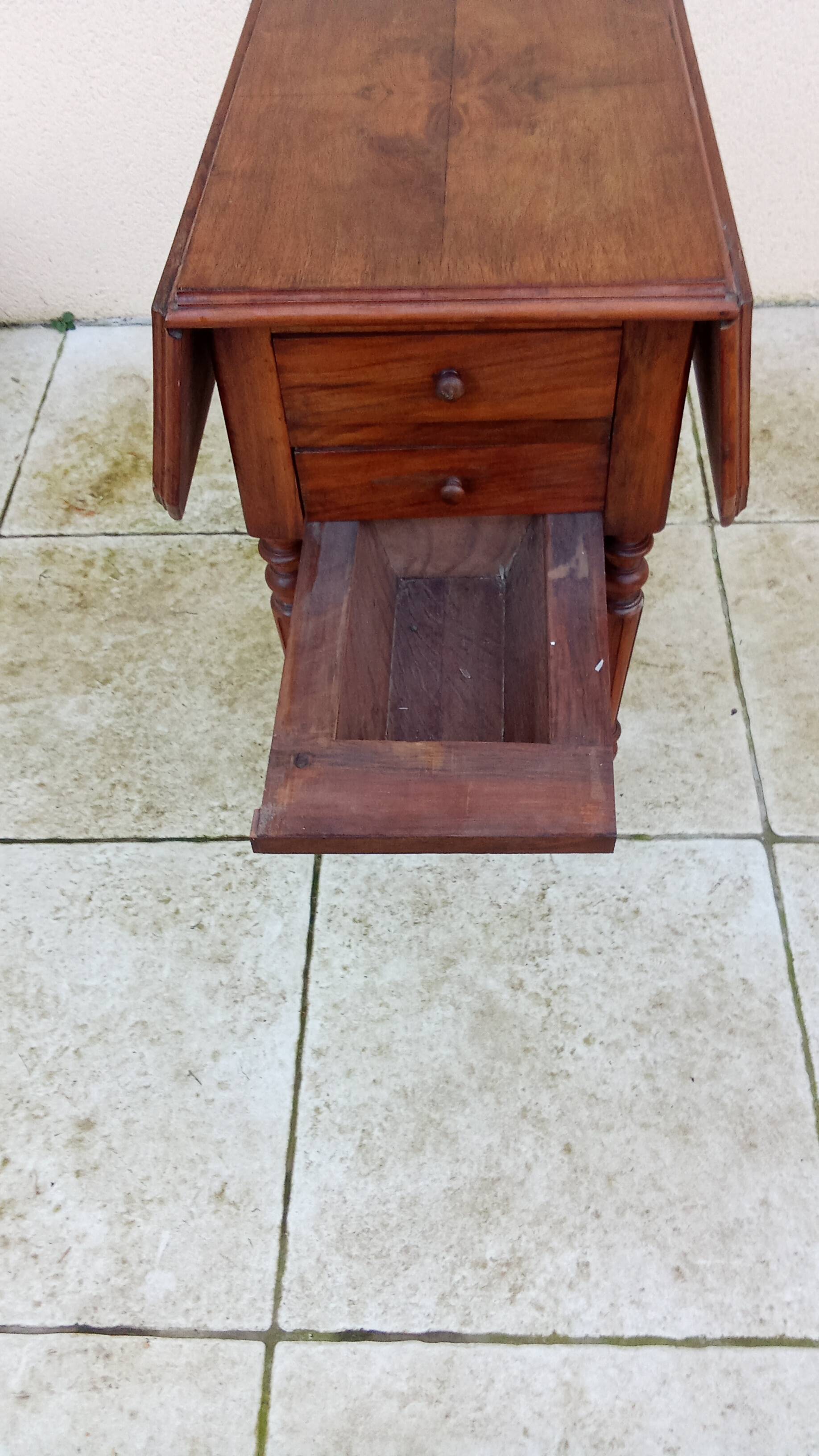 Antique small drop-leaf table from the 19th century.
