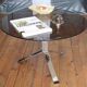 Round coffee table in smoked glass and chrome