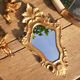 Miroir baroque bois doré et 2 angelots