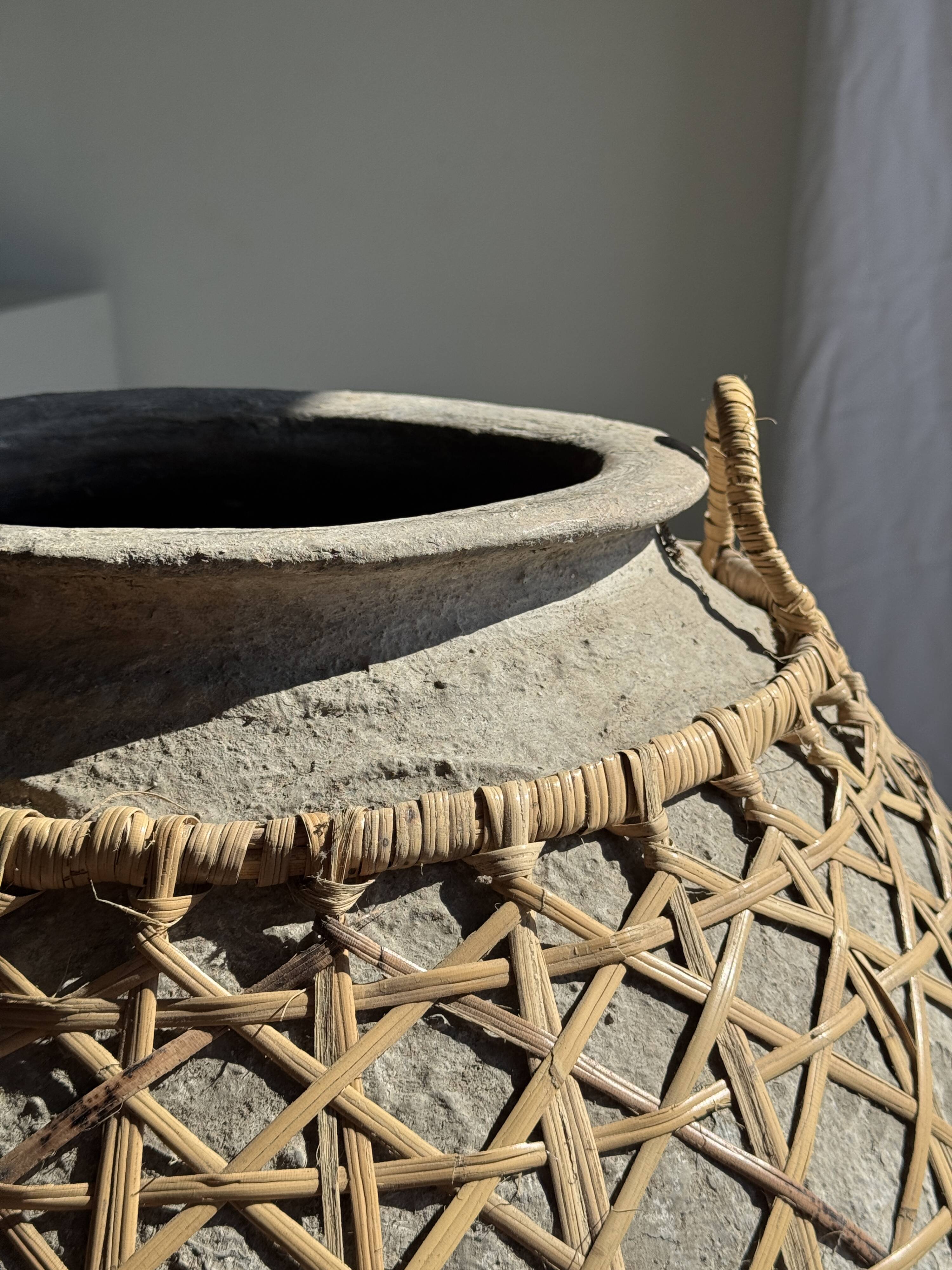 Immense light grey antique-style pot with a crosshatch lid and handles.