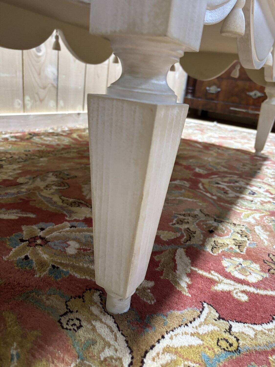 Painted wood coffee table with a distressed finish.