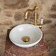 Small antique washbasin in wood and red marble.