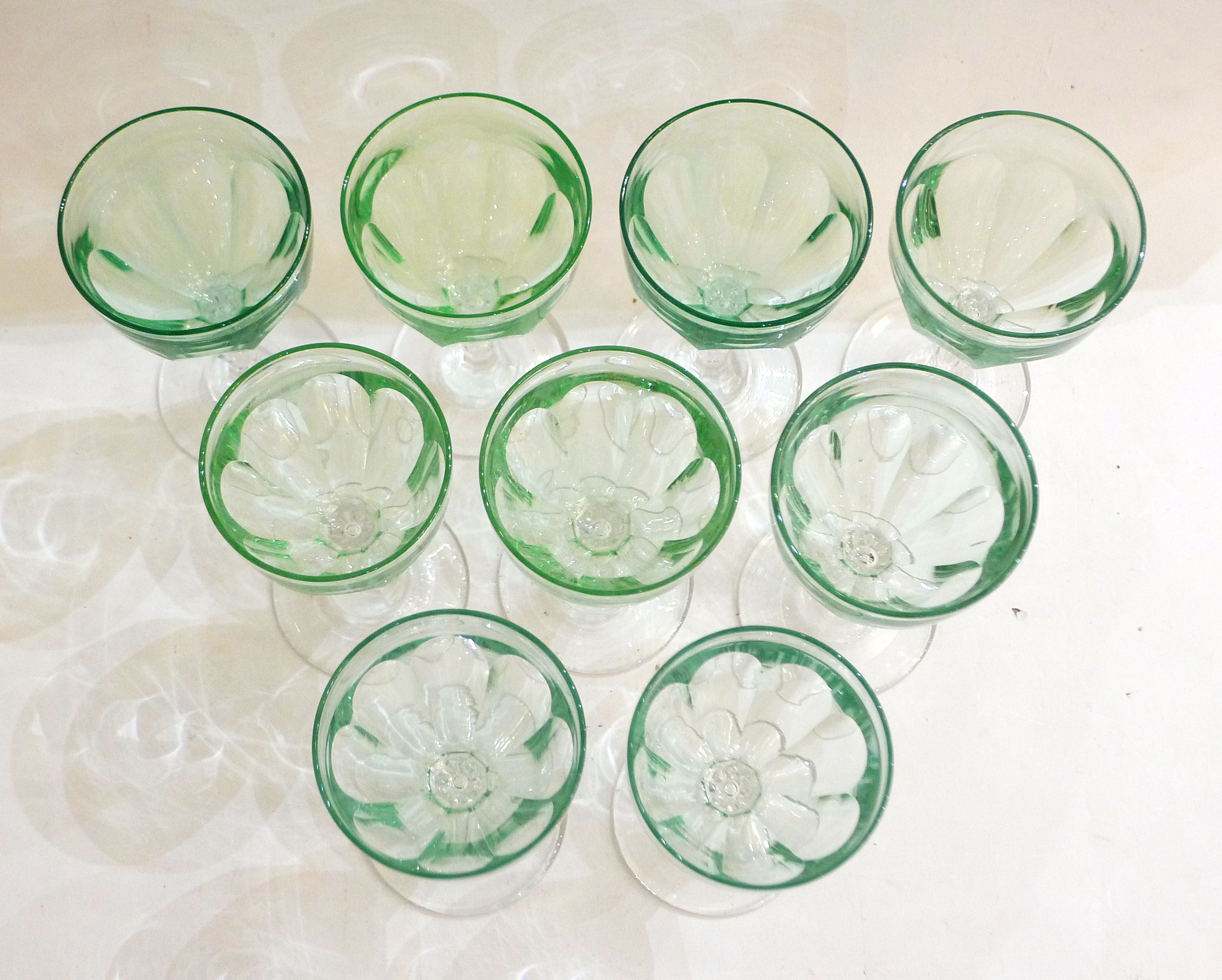 Set of nine glasses on foot in cut glass