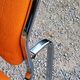 Pair of designer armchairs in orange fabrics and chrome tubes from the 70s