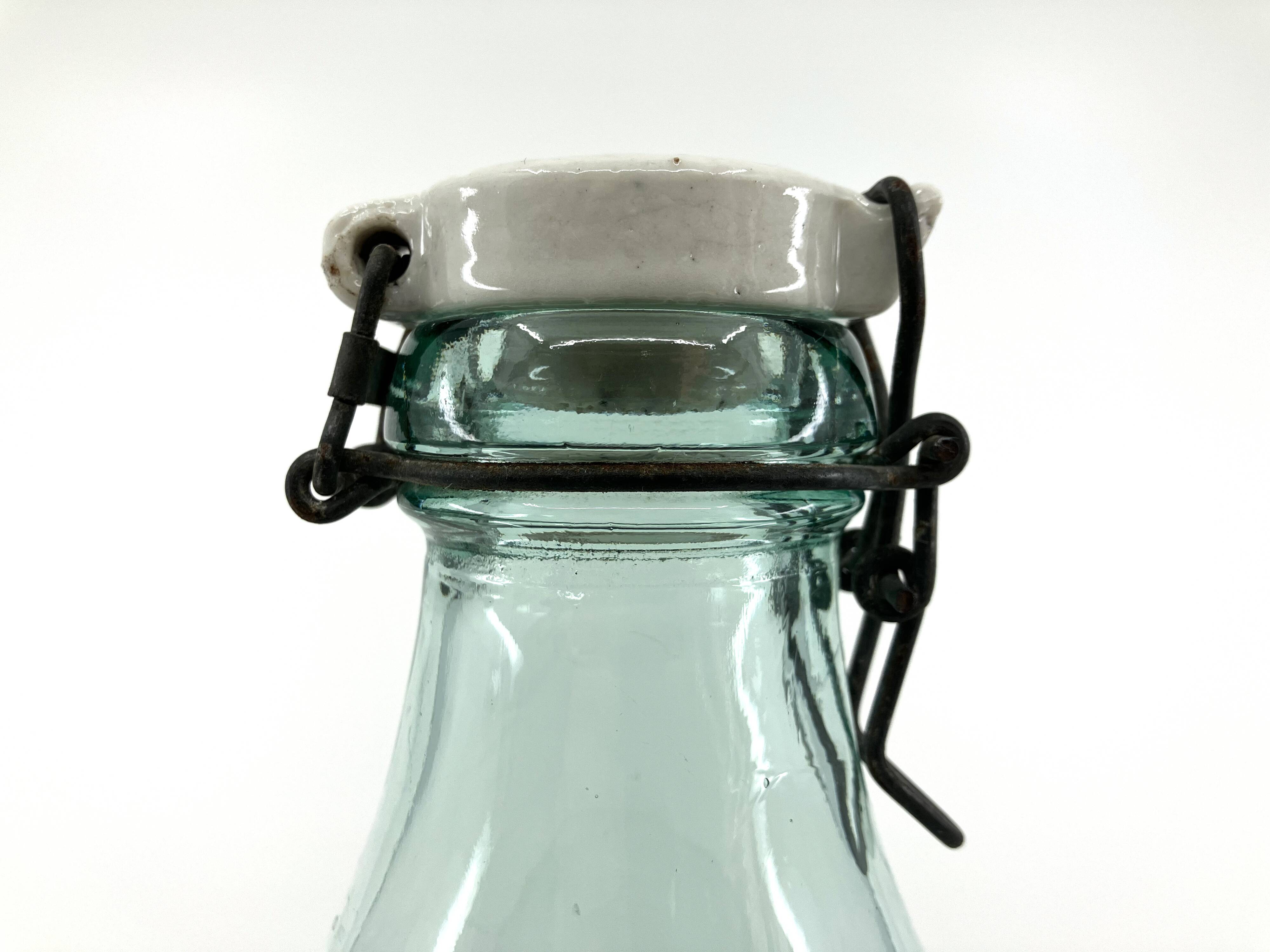 Large "Mercur" glass bottle with ceramic stopper • 2L • 1930