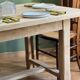 Farm table made of solid light oak wood.