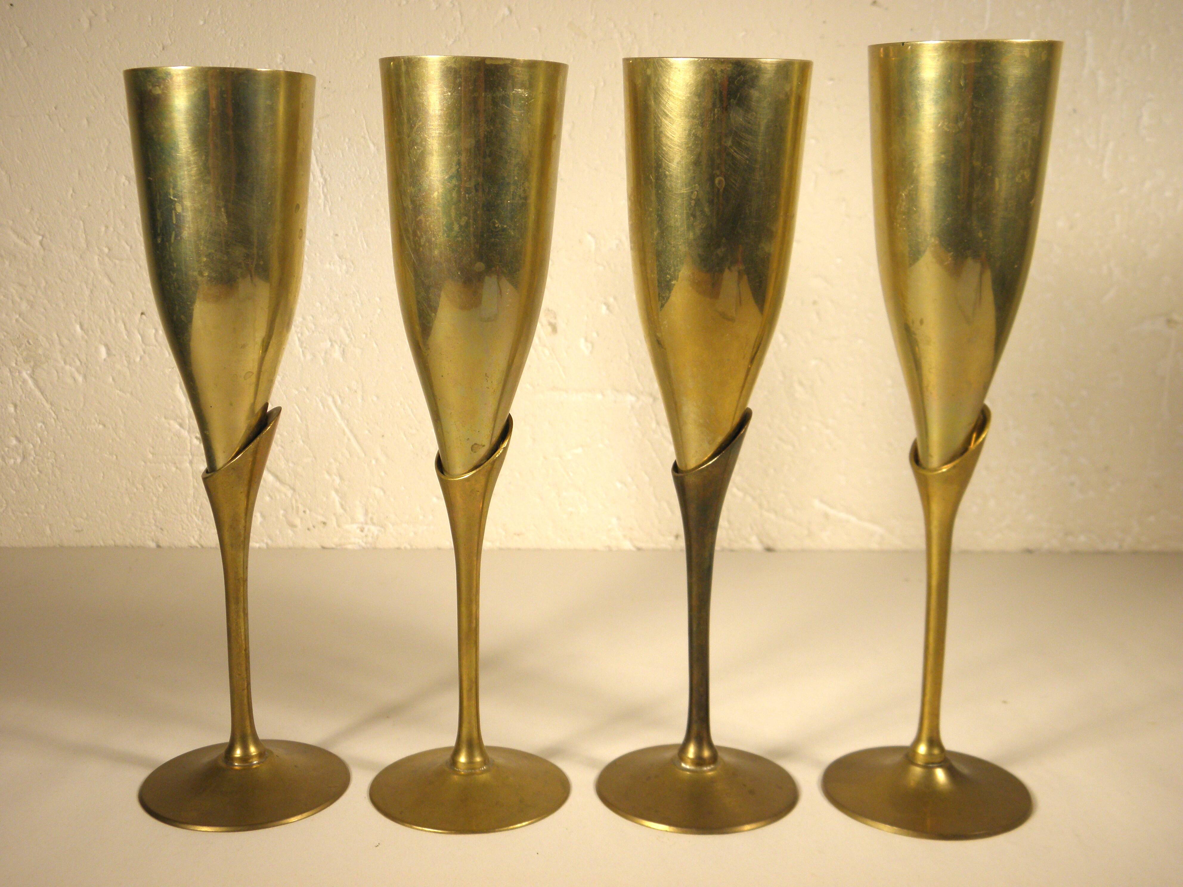 4 flutes, brass champagne glasses