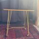 Vintage 1960s rolling dessert trolley in gold metal and formica.