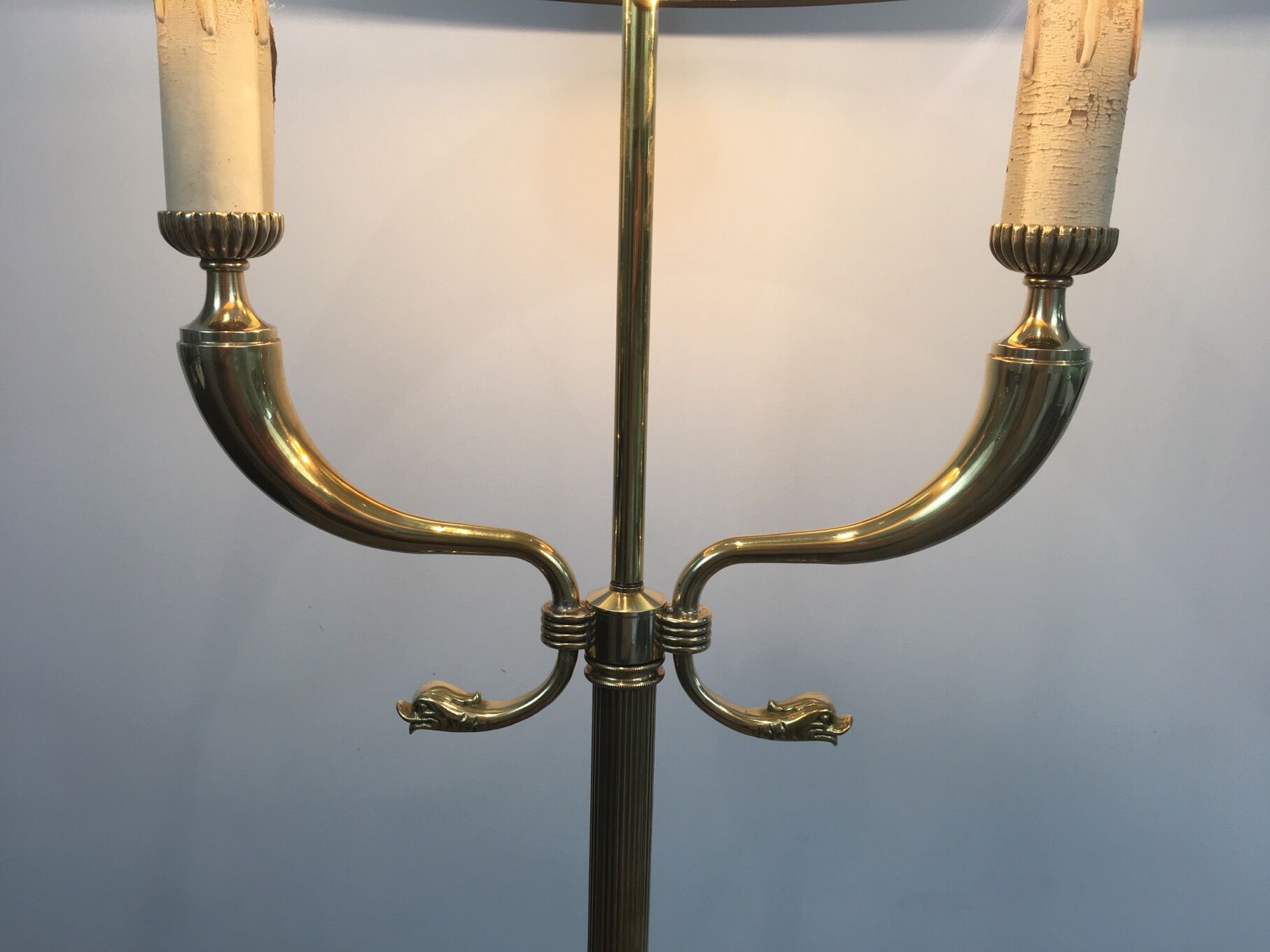 Floor lamp of parquet in neoclassical style in brass with dolphin heads. french work of the ma