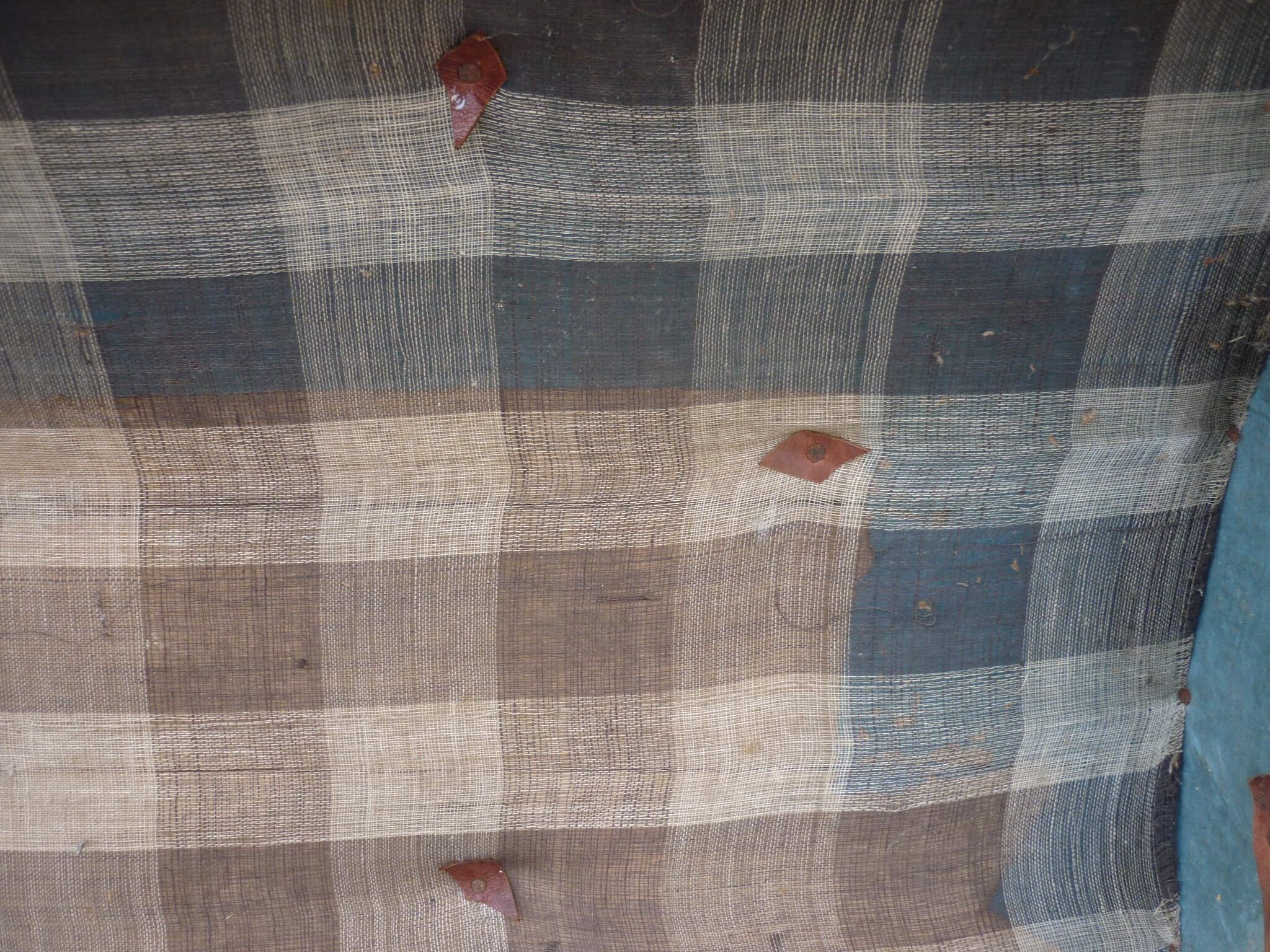 Old bulging wooden travel trunk