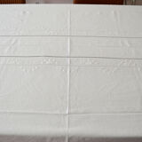 Old white tablecloth embroidered in linen