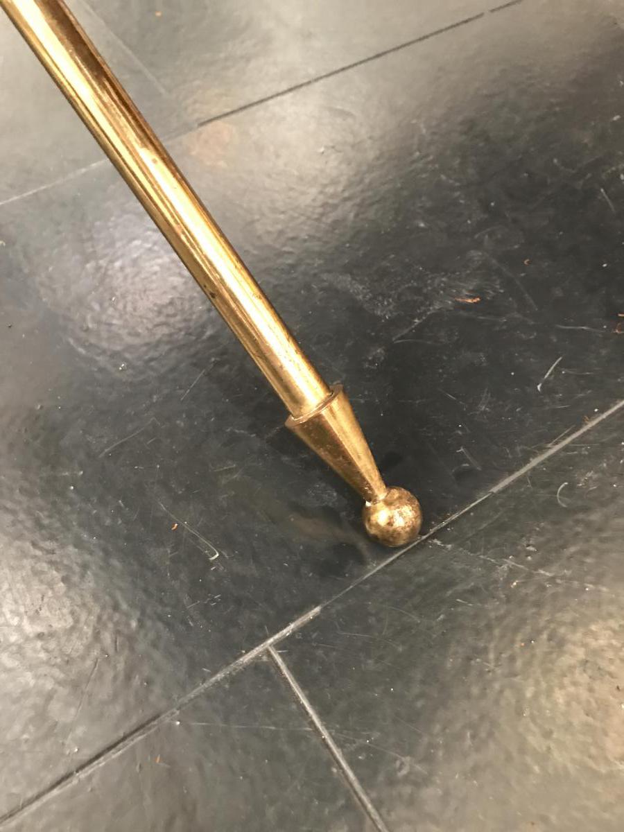 Golden brass table and lion heads circa 1950