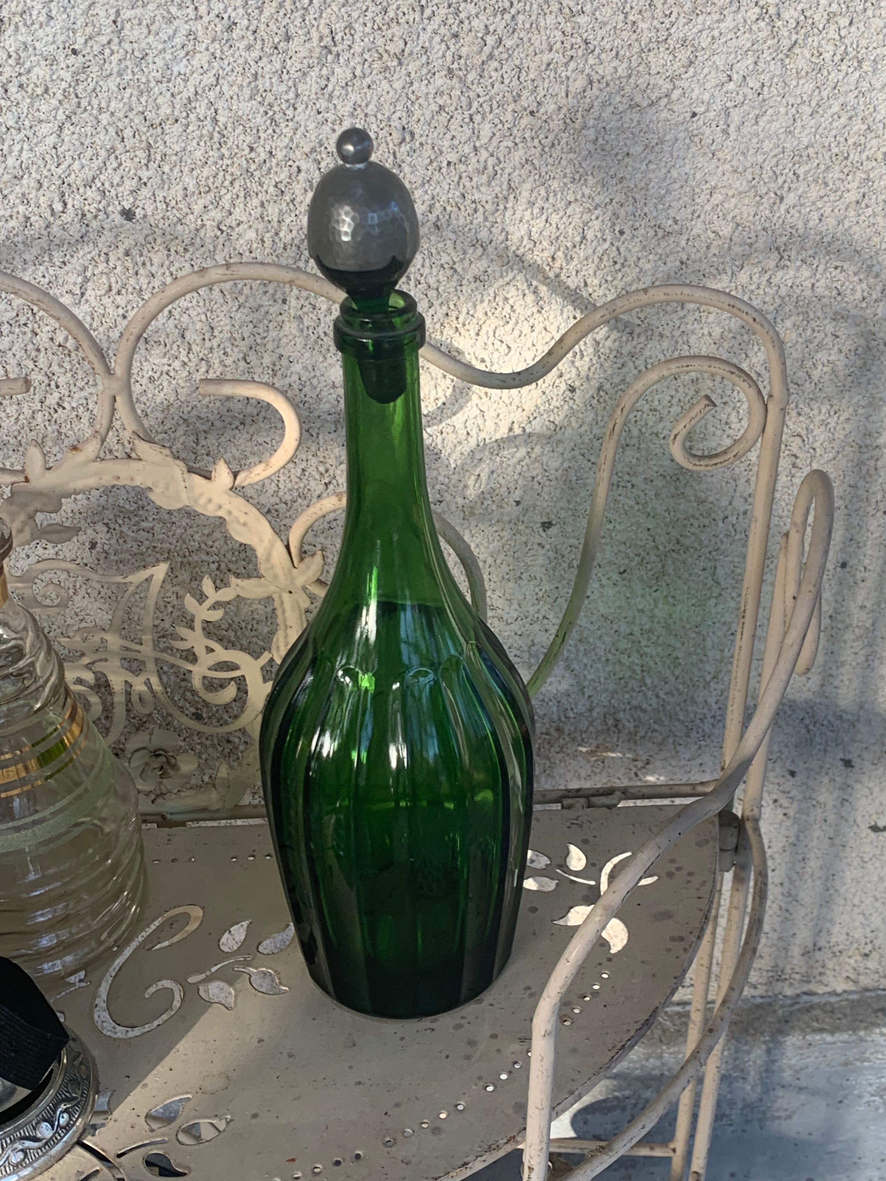 Bottle, green glass bottle green stopper and antique pewter