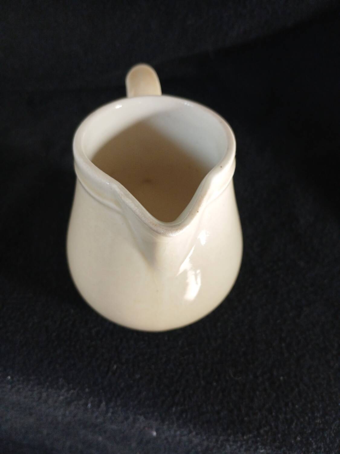 Old milk jug in steel clay