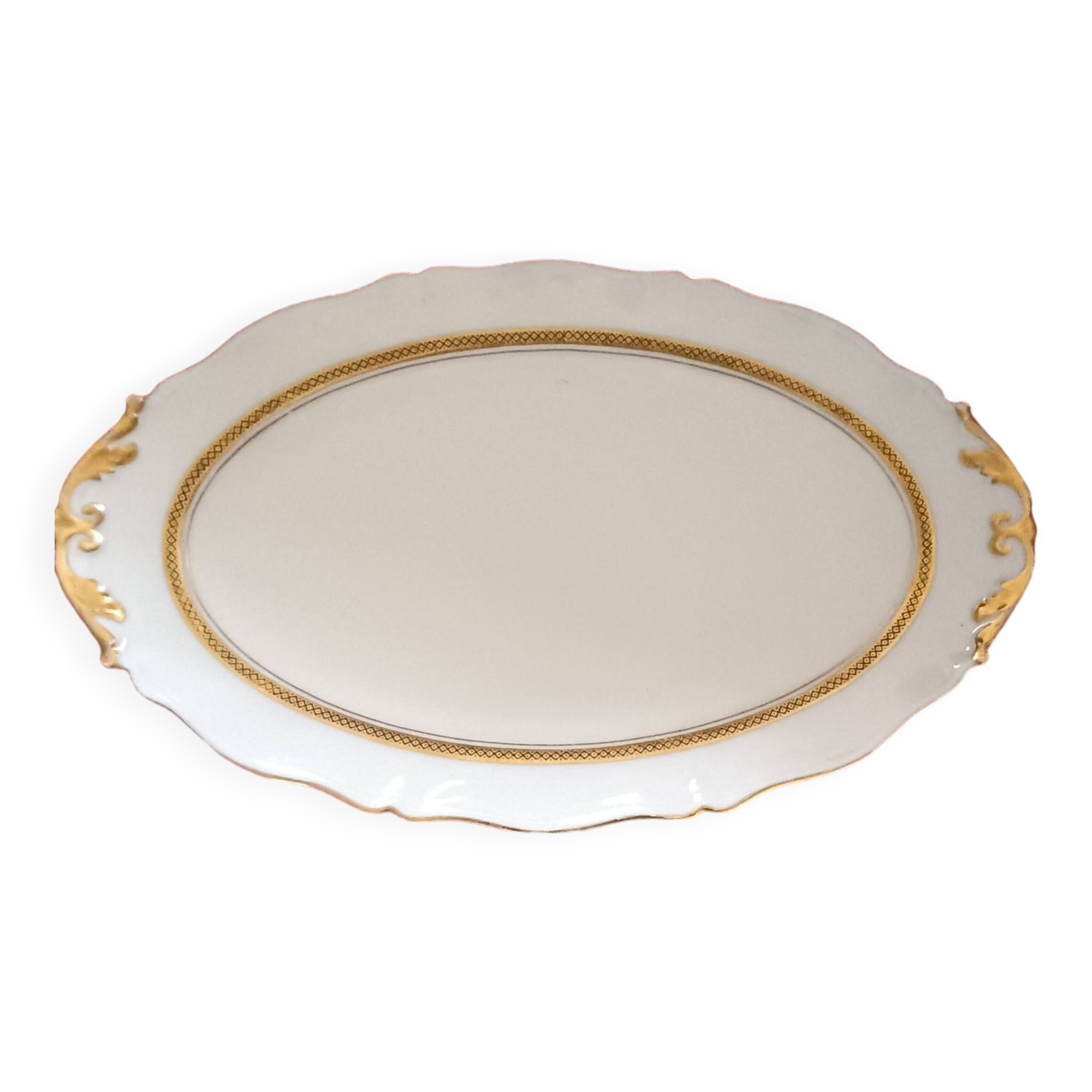 Oval dish. Limoges Montambert art porcelain. White matt gold rim;