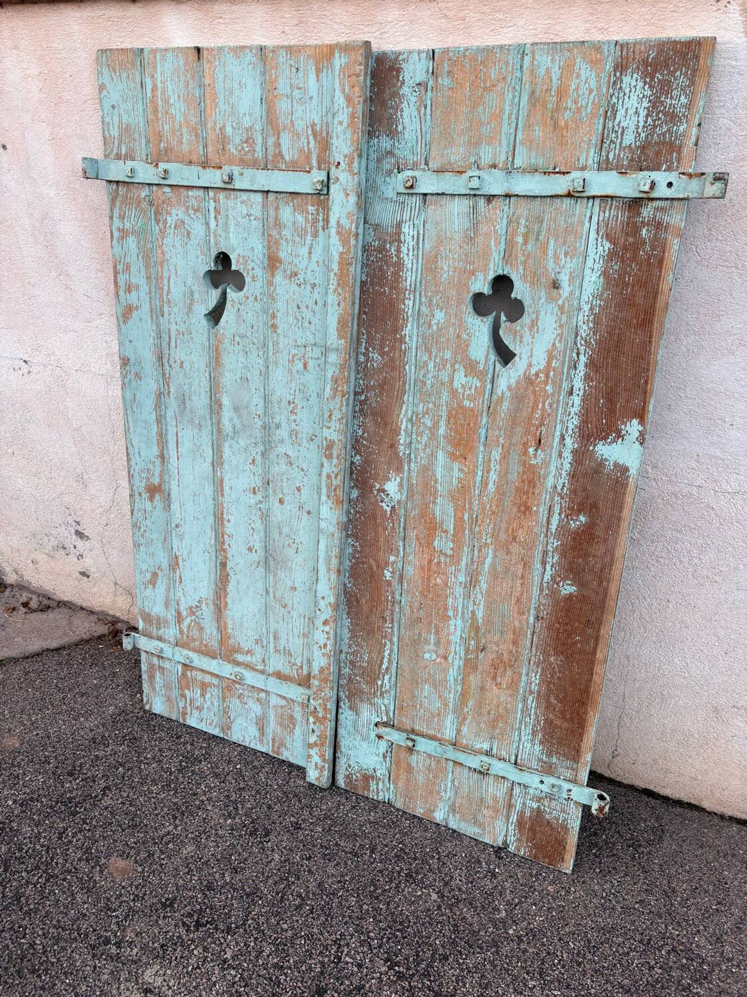 Pair of green wooden shutters