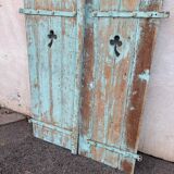 Pair of green wooden shutters