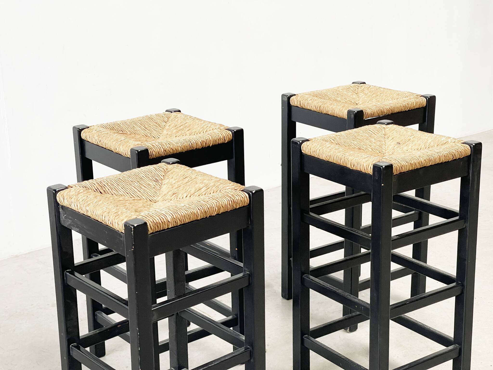 set of four rattan and wood barstools