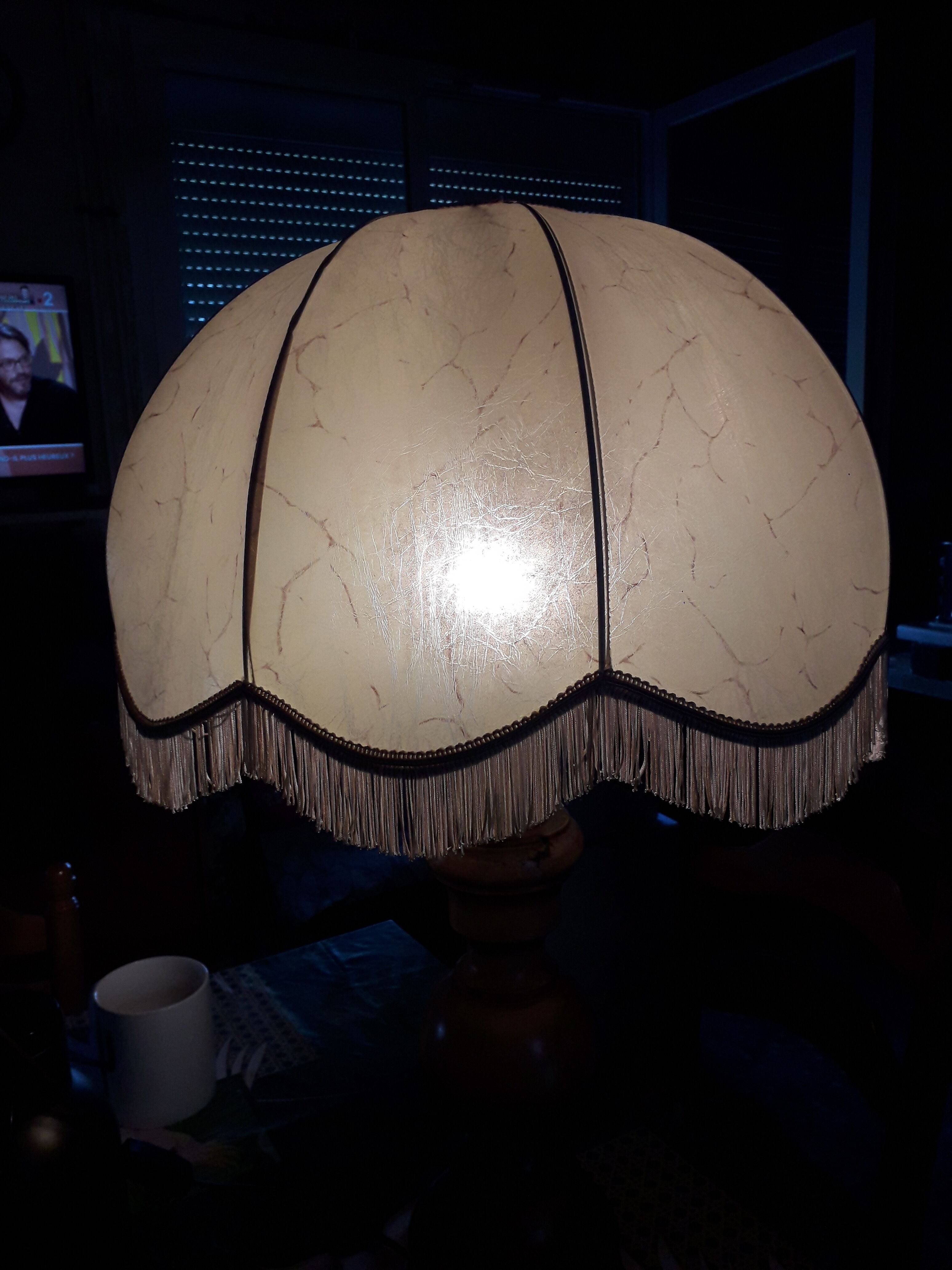 Turned wood table lamp with “skin” shade