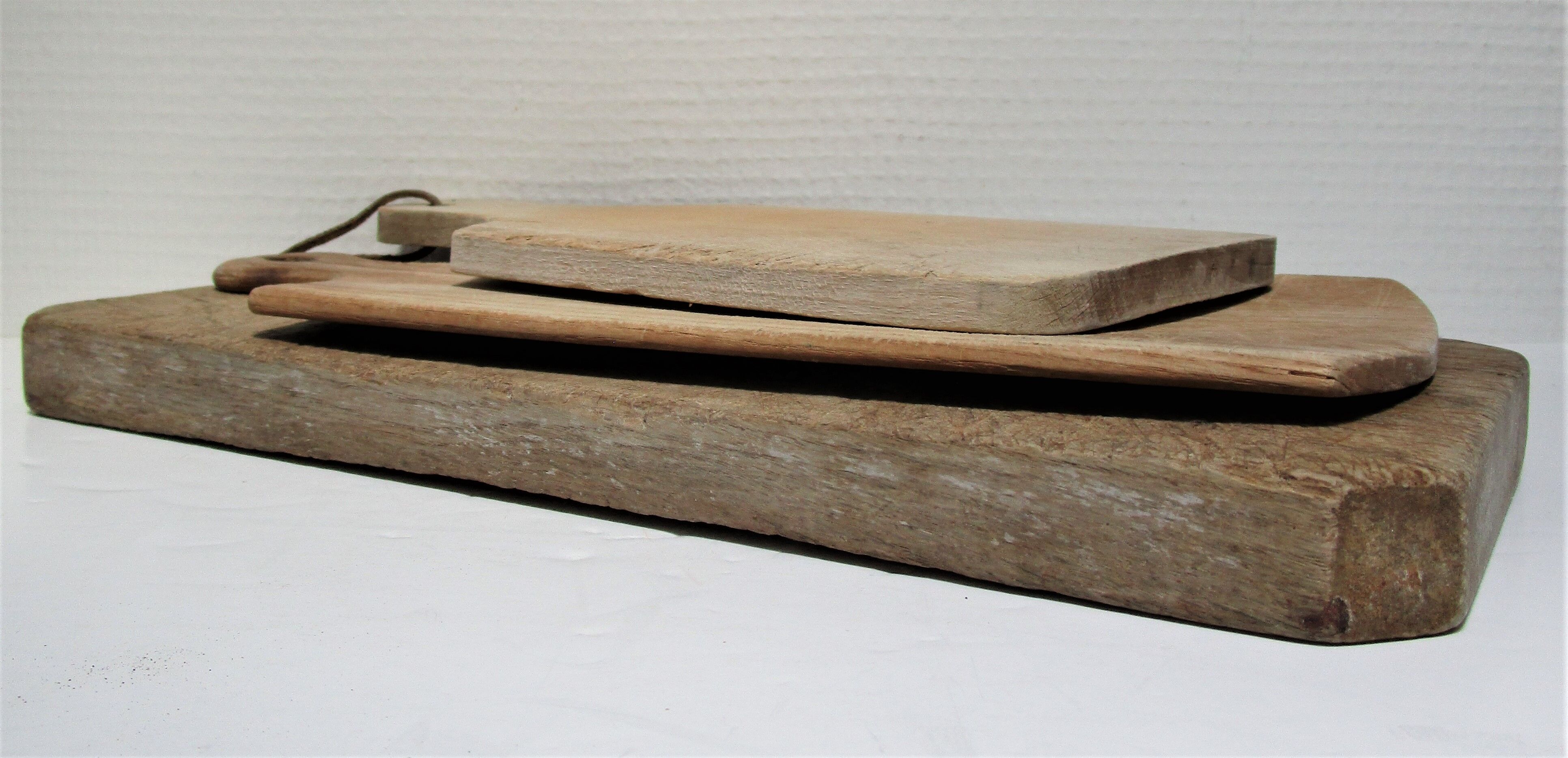 three vintage patinated solid wood cutting boards