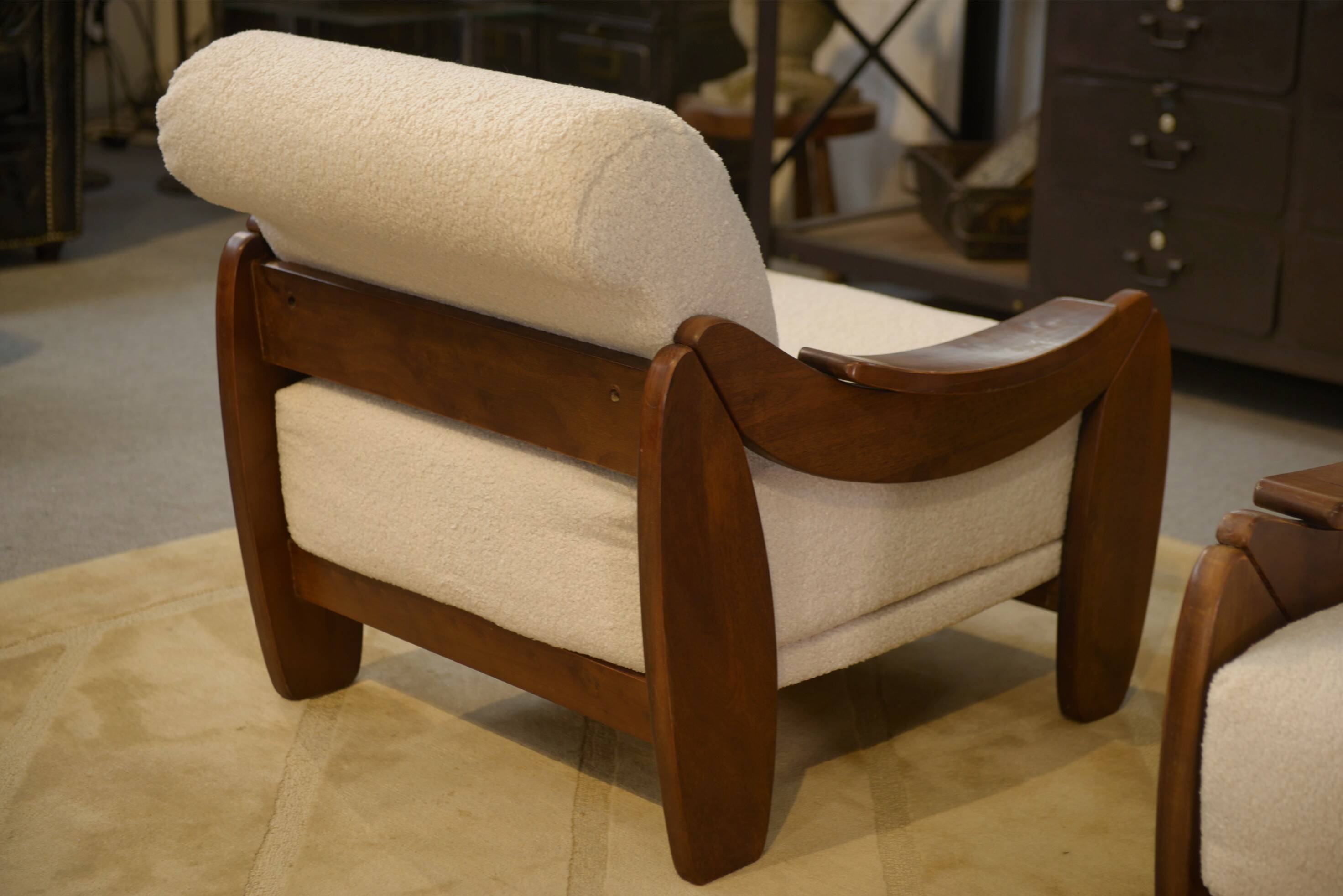 Brutalist pair of armchairs in mahogany and cream boucle 1970s.