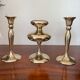 Three vintage brass candle holders