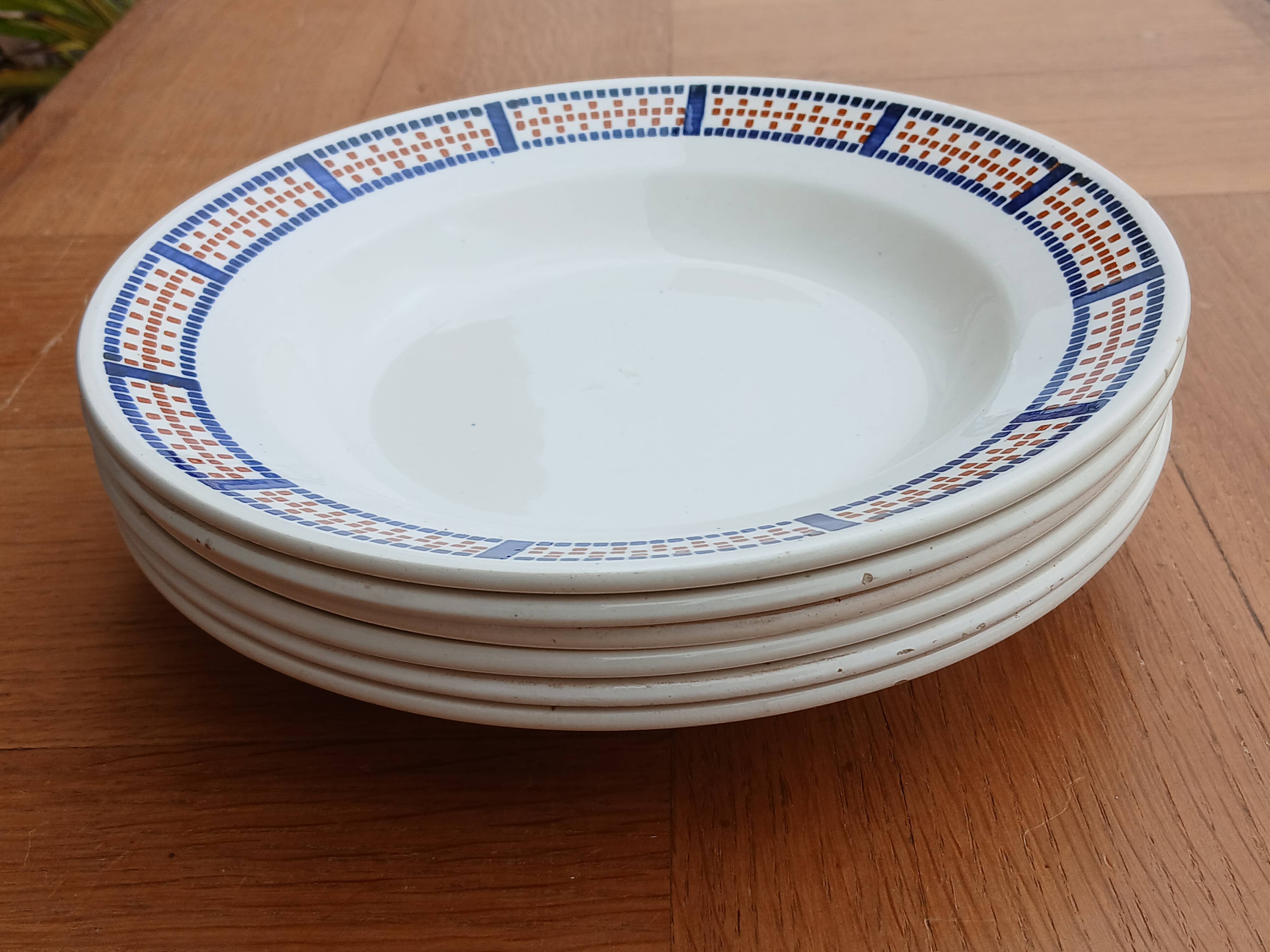 Six antique soup plates