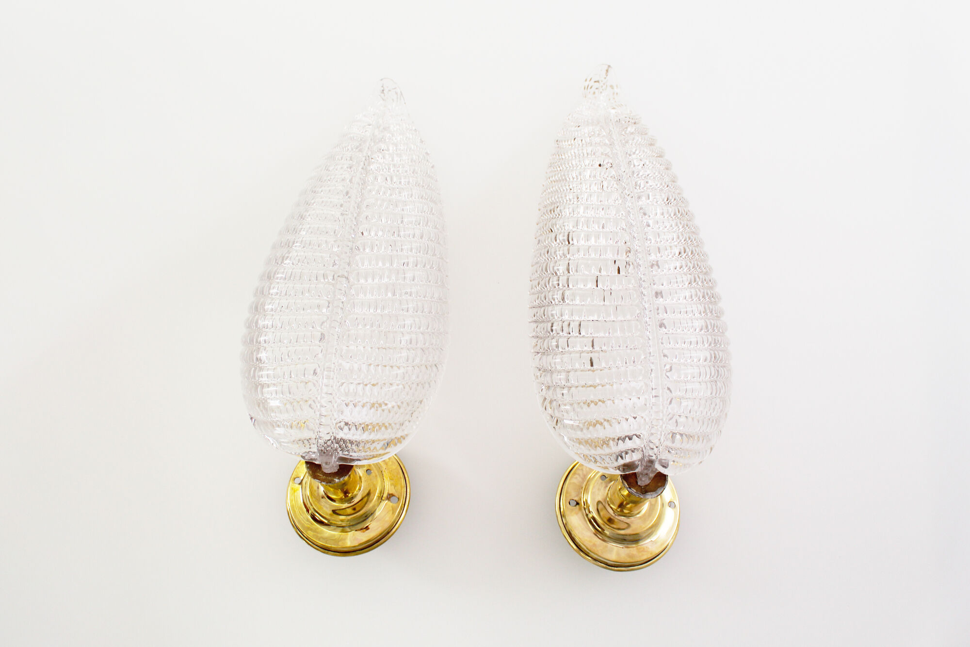 Pair of brass and muranoglass shell sconces