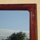 Large antique mirror in a flame mahogany frame; 132x82 cm