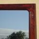Large antique mirror in a flame mahogany frame; 132x82 cm