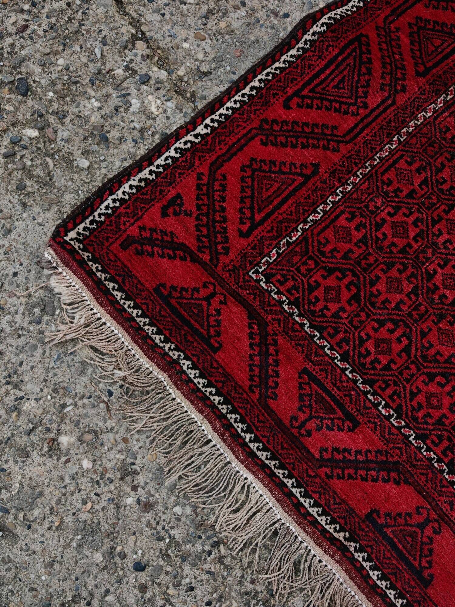 Vintage handmade Baluch rug with geometric pattern from the 1950s.