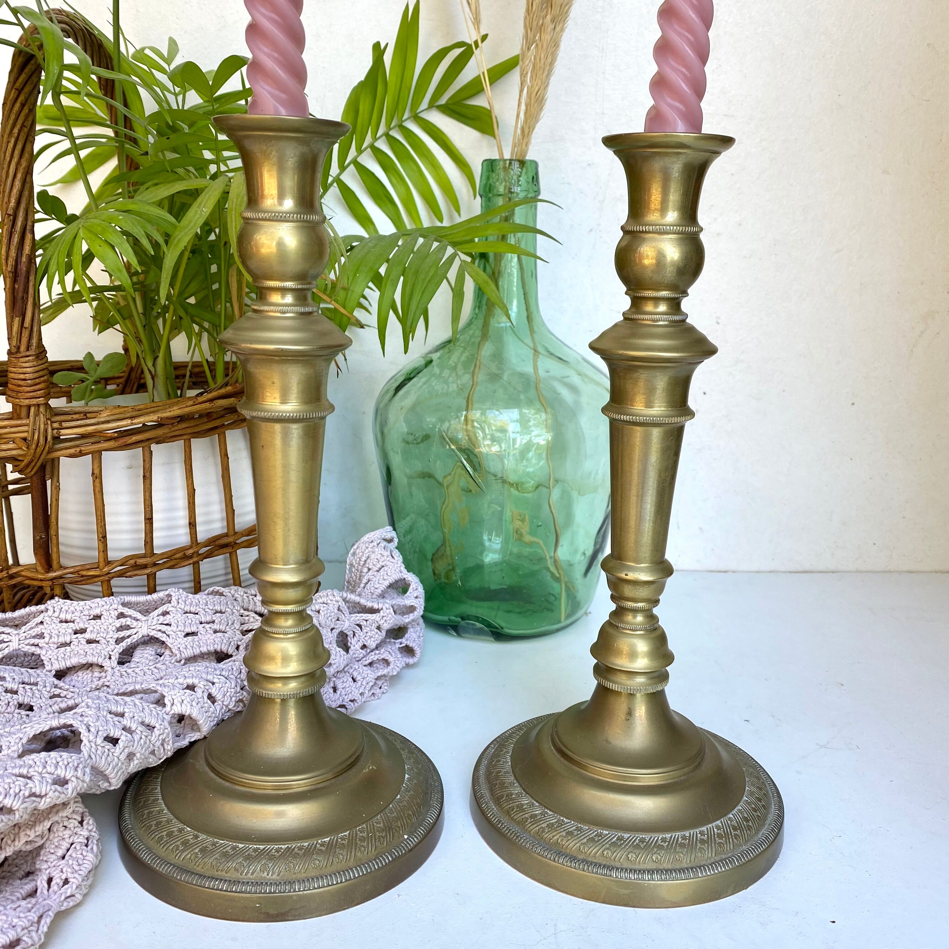 Pair of old candle holders in golden brass