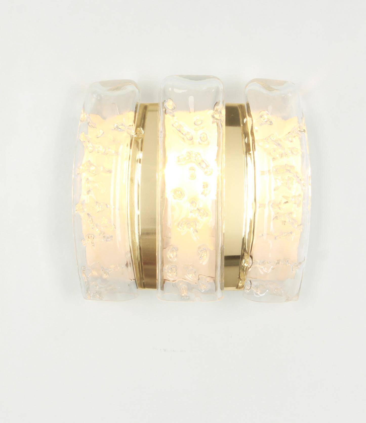 Pair of wall sconces in brass or ice glass by Doria, Germany, 1960s.