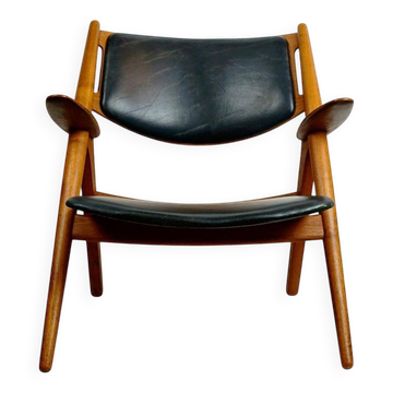 Chaise Lounge CH28 in Teak and Black Leather by Hans Wegner for Carl Hansen
