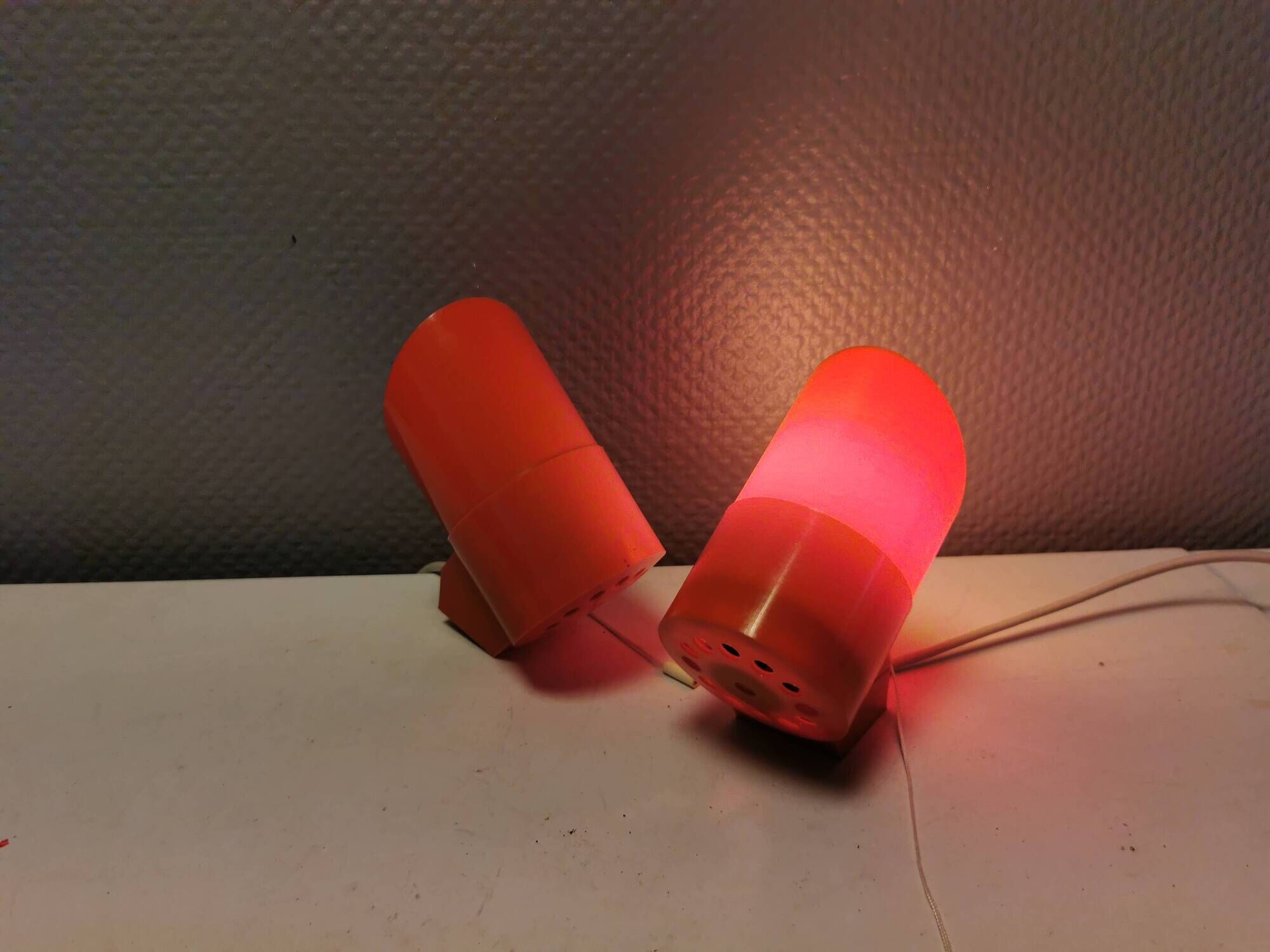A set of "Nathue" wall lamps (meaning night cap) in a retro red colour, 1970s Denmark.