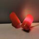 A set of "Nathue" wall lamps (meaning night cap) in a retro red colour, 1970s Denmark.