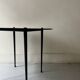 Vintage round black glass coffee table, 1950s
