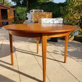 Round extendable teak dining table from the 60s